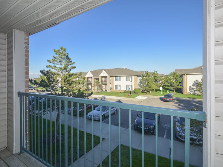 Exterior Balcony Overlooking the Lush Greenery and Landscaping